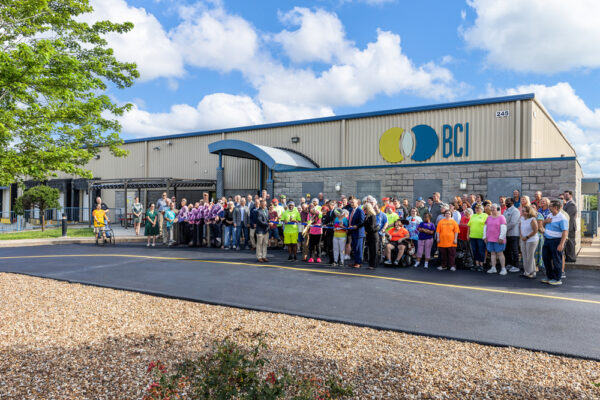 100+ people standing in front of BCI's Lincoln County plant for a ribbon-cutting event